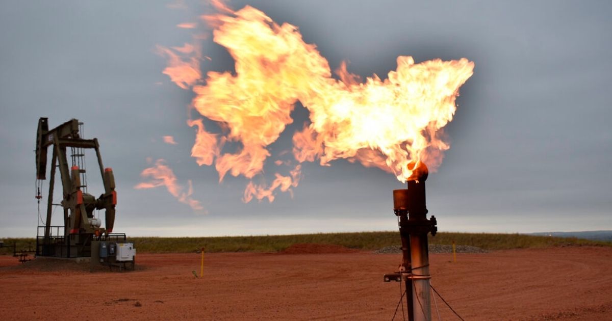 A flare burns natural gas at an oil well in Watford City, N.D., in this file photo from August 2021. The Biden administration has halted oil and gas leases on federal land, making the US even more dependent on foreign oil as prices skyrocket in response to Russia's invasion of Ukraine.