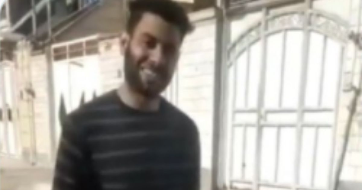 Sajjad Heydari, an Iranian man, is seen in a Feb. 5 video smiling, walking with a weapon and carrying his 17-year-old wife's, Mona Heydari, decapitated head as he walks around outside.