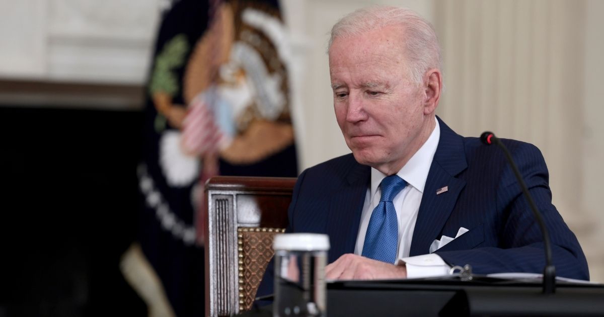 President Joe Biden listens during a meeting in the State Dining Room of the White House on Thursday in Washington, D.C.