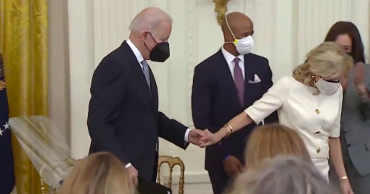 Social media was abuzz after a short clip made the rounds showing first lady Jill Biden leading President Joe Biden by the hand as he shuffled down a few stairs.