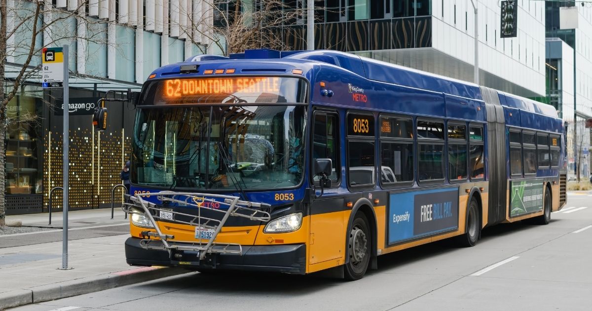 A King County Metro articulated bus drives through downtown Seattle on Jan. 23.