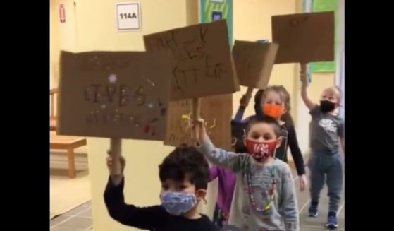 Children at the Lowell School in Washington hold "Black Lives Matter" signs.