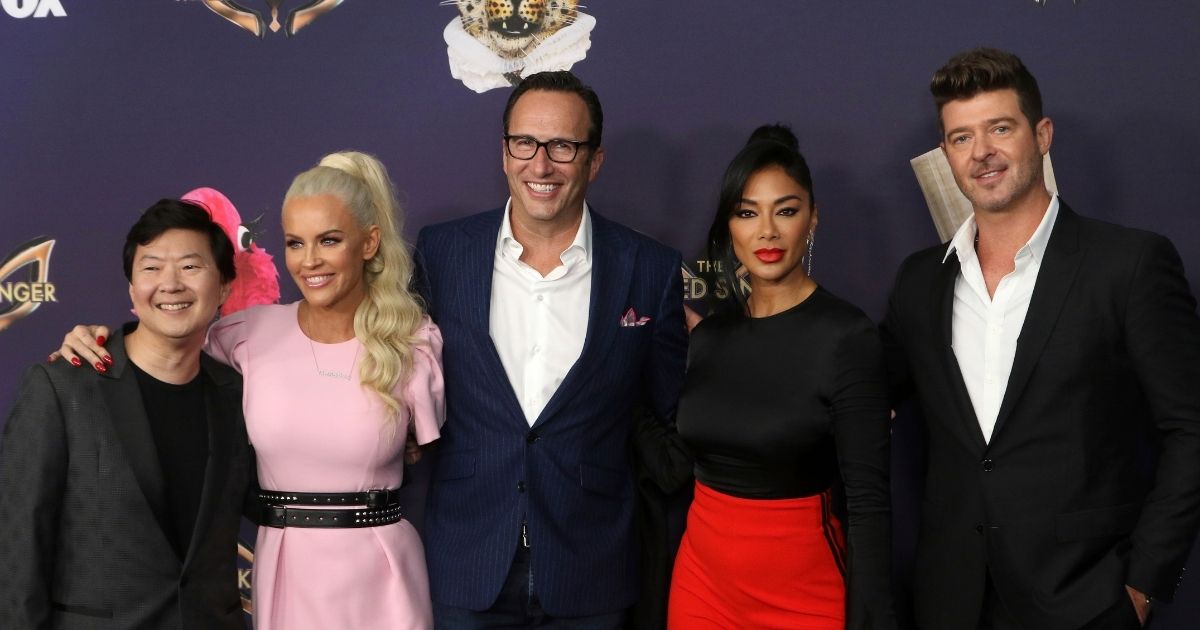 Judges for the Fox show "The Masked Singer," Ken Jeong, from left, Jenny Mcarthy, Charlie Collier, Nicole Scherzinger and Robin Thicke, are pictured together at the premiere of the show in Los Angeles, California, on Sept. 9, 2019. Jeong and Thicke walked off of the show during last week's show taping after Rudy Giuliani was revealed to be one of the contestants.