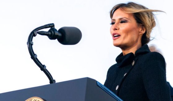 Former first lady Melania Trump, seen speaking in January 2021, blamed politics for an Oklahoma school declining her offer of scholarship funds for its students. She vowed to continue helping programs that benefit foster children and other young people.