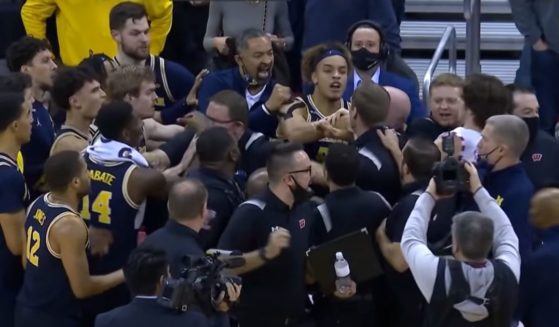 A postgame fight breaks out between Juwan Howard's Michigan Wolverines and the Wisconsin Badgers.