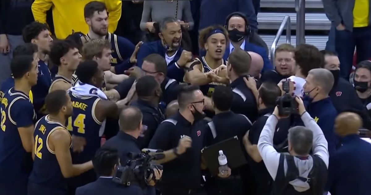 A postgame fight breaks out between Juwan Howard's Michigan Wolverines and the Wisconsin Badgers.