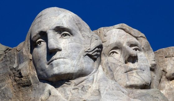 Images of Founding Fathers George Washington and Thomas Jefferson are carved in granite at Mount Rushmore National Memorial in South Dakota.