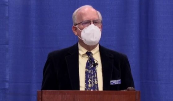 Hudson, New Hampshire, town moderator Paul Inderbitzen ordered parents without face masks to move to the back of the room during a school board meeting on Saturday.