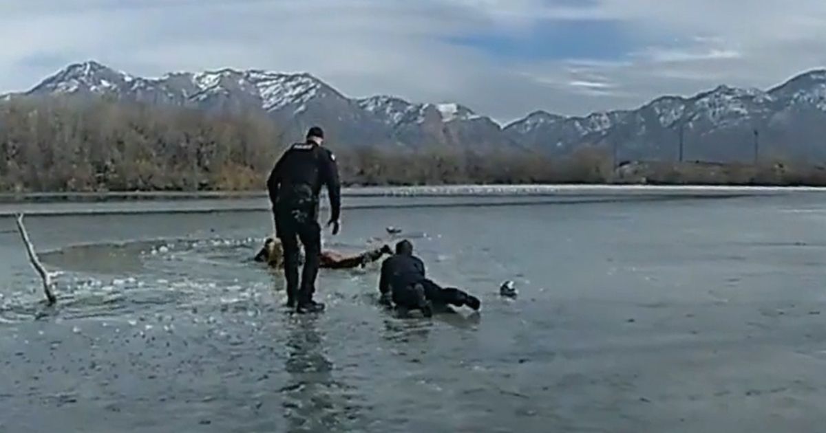 Police officers in Ogden, Utah, move out onto the ice to rescue an autistic teenager.