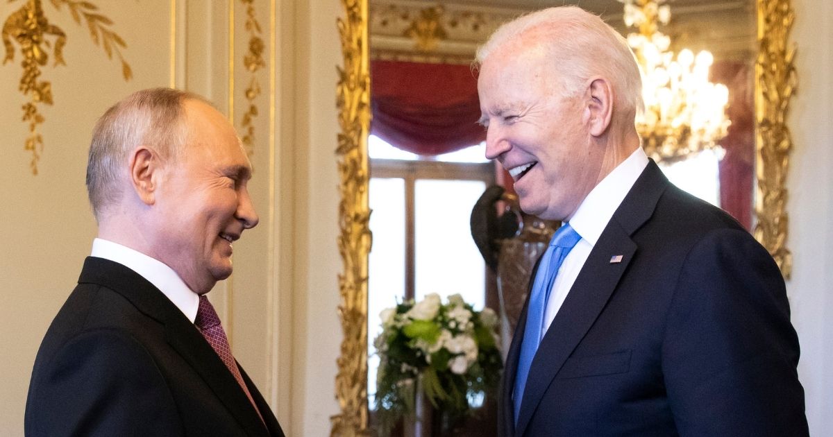 Russian President Vladimir Putin, left, and his U.S. counterpart, Joe Biden, share a laugh as they meet for a summit at Villa La Grange in Geneva, Switzerland, on June 16, 2021.