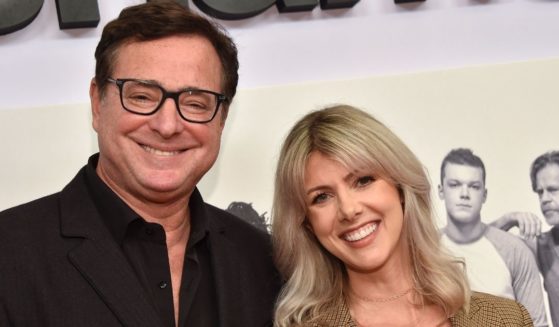 Actor Bob Saget, seen with his wife Kelly Rizzo at a 2019 premiere, joked during an October podcast conversation with Rizzo that he would be 'found dead in bed.'