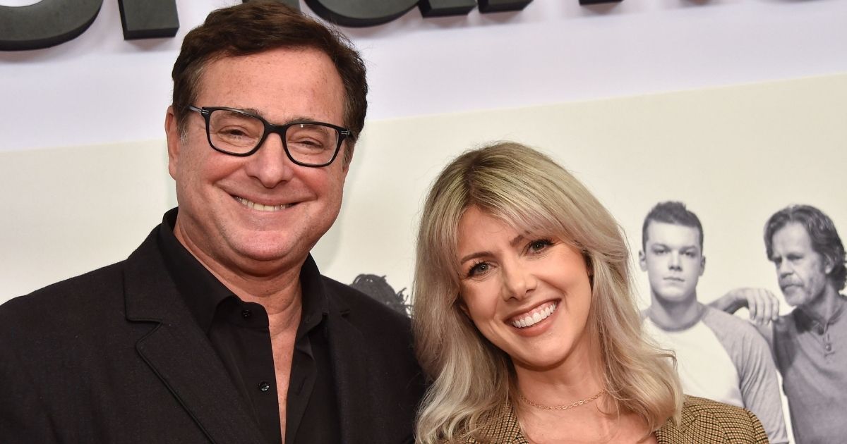 Actor Bob Saget, seen with his wife Kelly Rizzo at a 2019 premiere, joked during an October podcast conversation with Rizzo that he would be 'found dead in bed.'