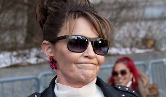 Former Alaska Gov. Sarah Palin reacts as she leaves the courthouse in New York on Monday.