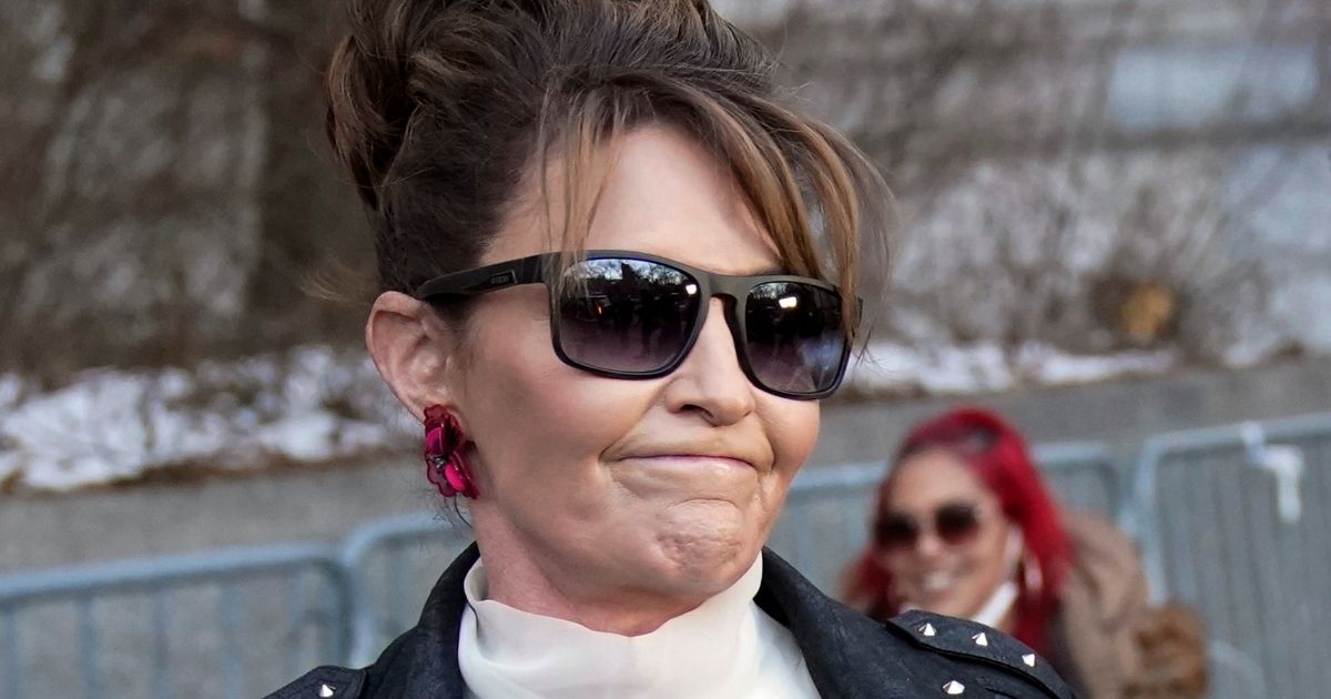 Former Alaska Gov. Sarah Palin reacts as she leaves the courthouse in New York on Monday.
