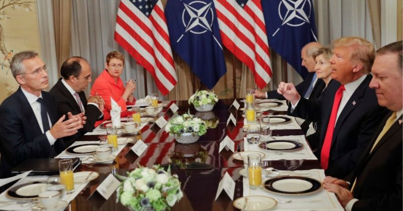 President Donald Trump, right, makes a point in a conversation with NATO Secretary General Jens Stoltenberg, left, during their bilateral breakfast in Brussels on July 11, 2018.