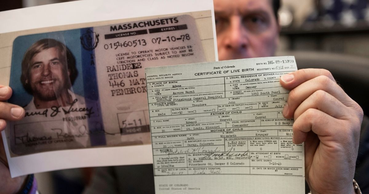 U.S. Marshal Peter J. Elliott holds the birth certificate and a copy of the driver's license of Ted Conrad