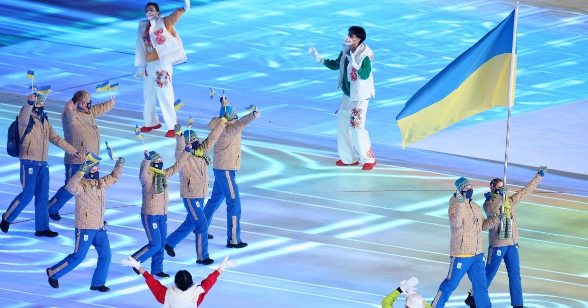 Team Ukraine enters Beijing National Stadium during the Opening Ceremony of the 2022 Winter Olympics on Friday in Beijing.