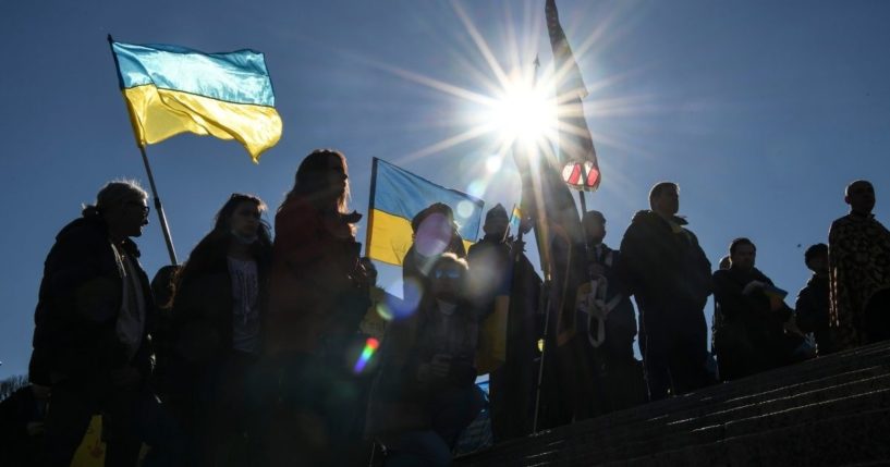 Demonstrators gather at the Lincoln Memorial in solidarity with Ukraine before marching to the White House on Sunday in Washington, D.C.