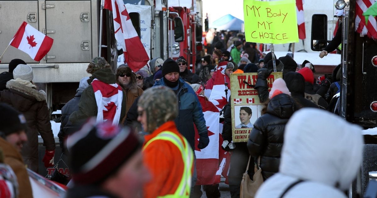 A street scene of truckers and supporters continuing to protest against mandates and restrictions related to COVID-19 vaccines in Ottawa, Ontario, Canada, on Saturday.