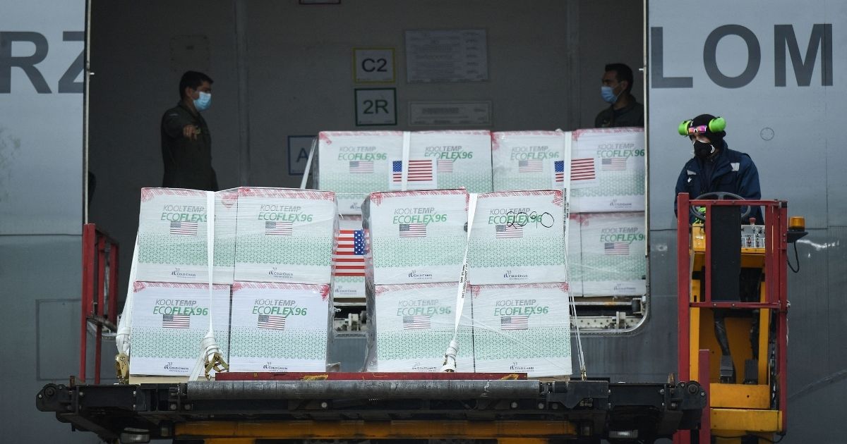 Members of the Colombian Air Force unload 2.5 million doses of the Johnson & Johnson vaccine in Bogota in July.