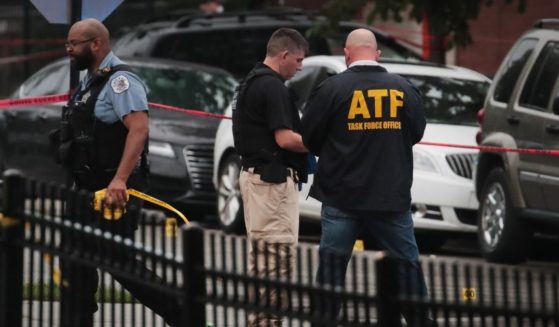 An agent of the Bureau of Alcohol, Tobacco and Firearms is pictured on the scene of a shooting at a Chicago funeral home in 2020.