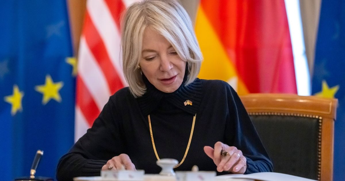 Amy Gutmann, the Biden administration's ambassador to Germany, signs a guest book during her accreditation ceremony at the German president's residence in Berlin on Feb. 17.