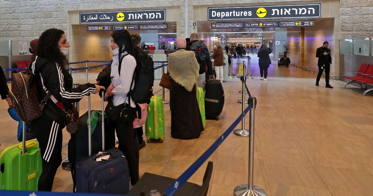 A December photo shows travelers at Israel's David Ben-Gurion Airport.