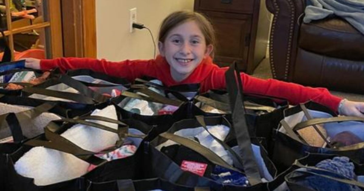 Sophie Enderton, a 10-year-old from Niagara County, New York, shows the joy she gets from making chemo comfort bags for patients at the Roswell Park Comprehensive Cancer Center.
