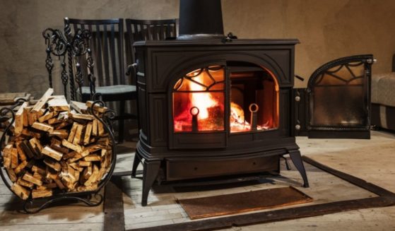 A wood-burning stove generates warmth in a country home.
