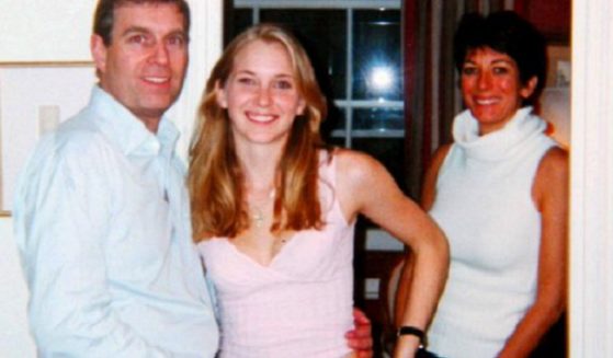 British Prince Andrew, Virginia Roberts Giuffree, center, and Ghislaine Maxwell in a photo taken about 2000.