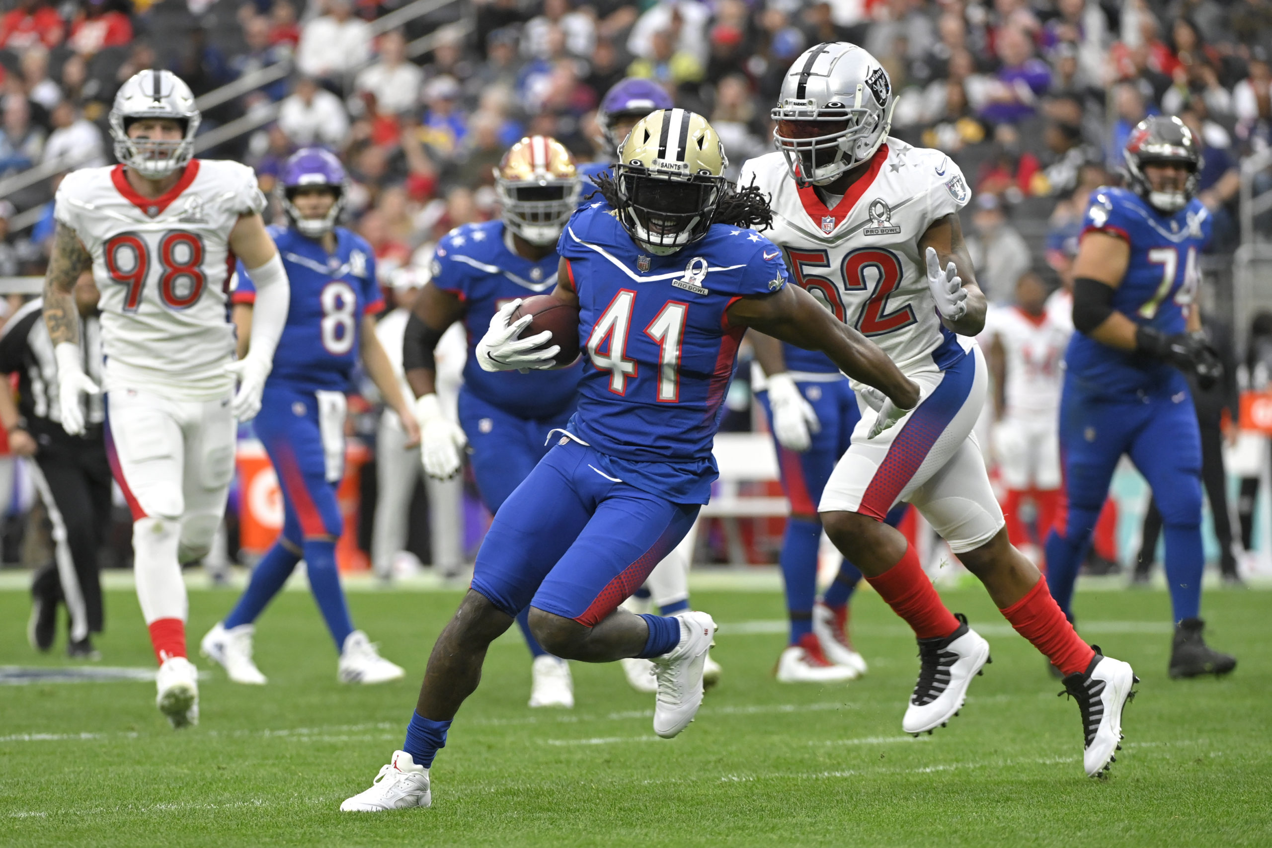 NFC running back Alvin Kamara (41) of the New Orleans Saints rushes during the first half of the NFL's Pro Bowl on Feb. 6, 2022.