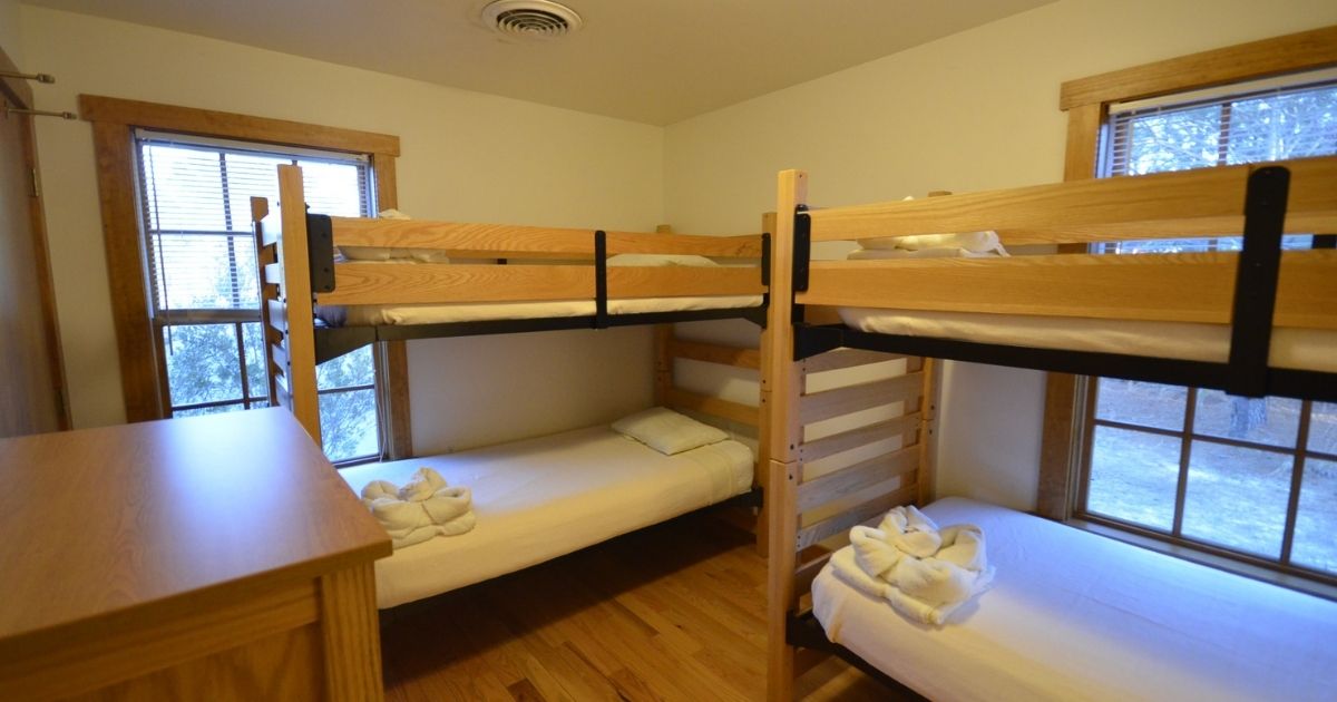 Cabin C at Kiptopeke State Park has a room full of bunk beds, similar to many rooms and cabins at children's camps.