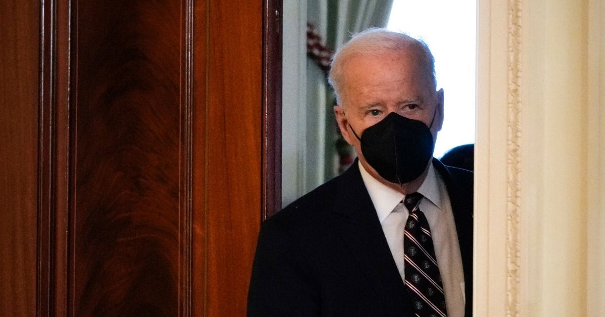 President Joe Biden arrives to deliver remarks on developments in Ukraine and Russia, and announces sanctions against Russia, from the East Room of the White House on Tuesday.