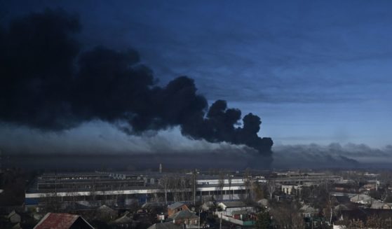Black smoke rises from a military airport in Chuguyev, Ukraine, near Kharkiv, on Thursday.