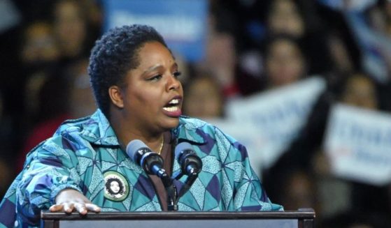 Black Lives Matter co-founder Patrisse Cullors, seen speaking at a Bernie Sanders presidential campaign rally in March of 2020, is shifting blame for the group's financial irregularities..