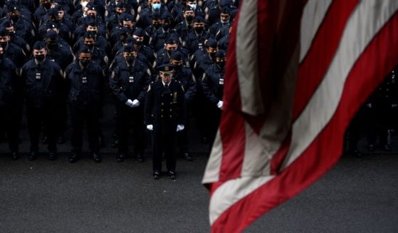 New York police officers gather for the funeral of officer Wilbert Mora on Wednesday in New York.