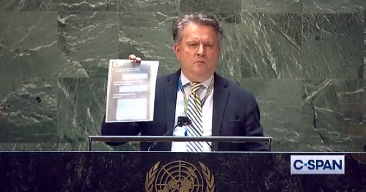 Sergiy Kyslytsya, Ukraine's ambassador to the United Nations, holds what he said was a screen shot of text messages a Russian soldier exchanged with his mother before the soldier's death.