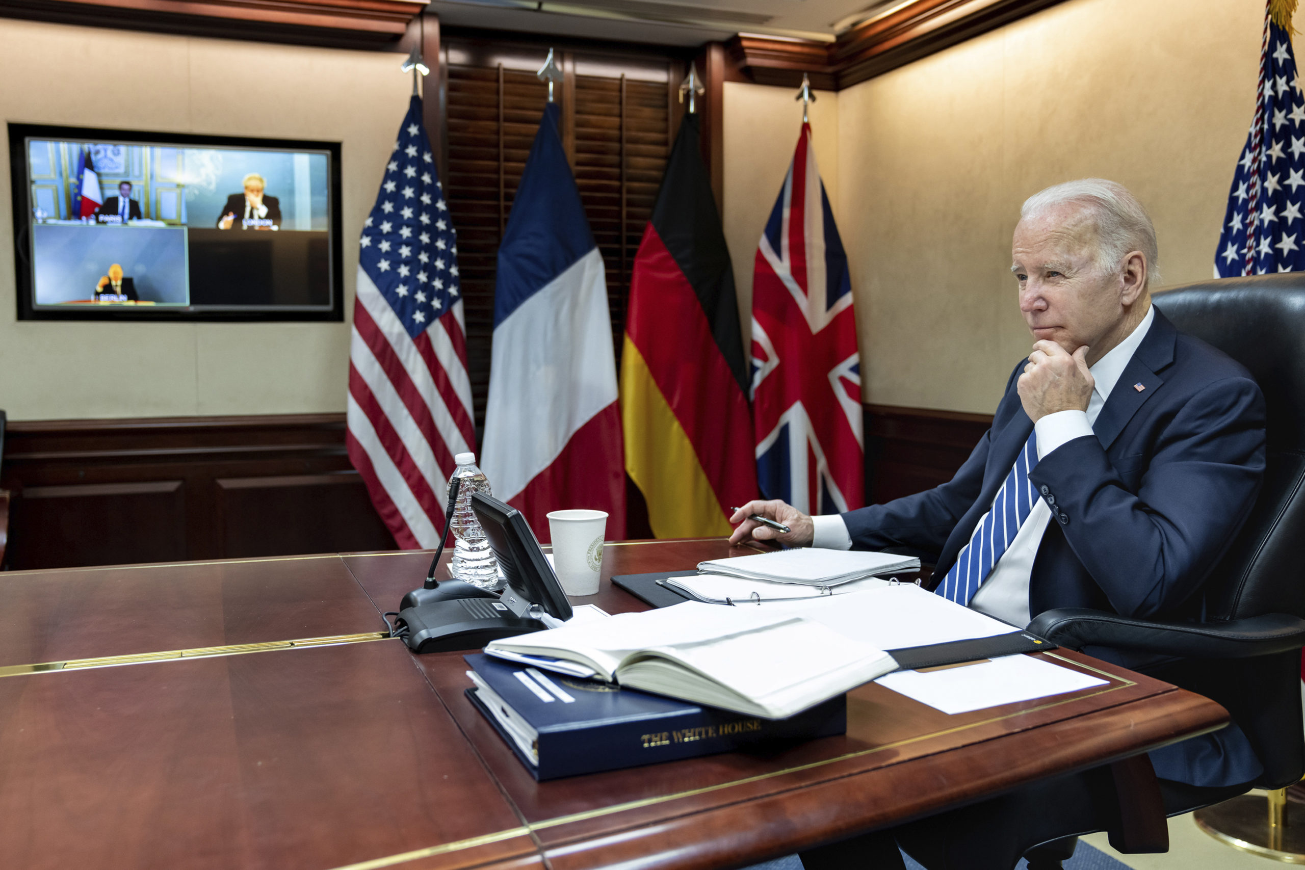 President Joe Biden listens during a secure video call with French President Emmanuel Macron, German Chancellor Olaf Scholz and British Prime Minister Boris Johnson in the Situation Room at the White House on Monday.