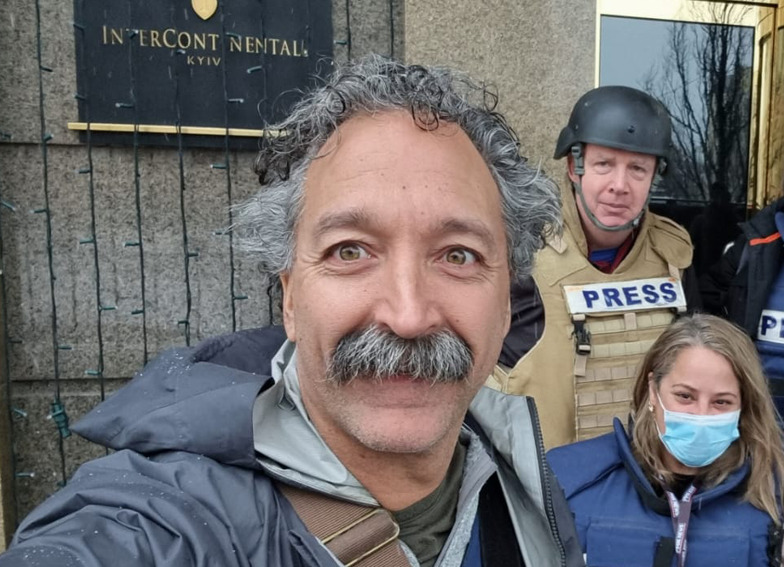 This image released by Fox News Channel shows cameraman Pierre Zakrzewski while on assignment with hi colleagues, Fox News correspondent Steve Harrigan and Jerusalem-based senior producer Yonat Friling, background right, in Kyiv. Zakrzewski was killed in Ukraine on Monday when the vehicle he was traveling in was struck by incoming fire. Zakrzewski was a veteran war photographer who had covered conflicts in Iraq, Afghanistan and Syria for Fox.