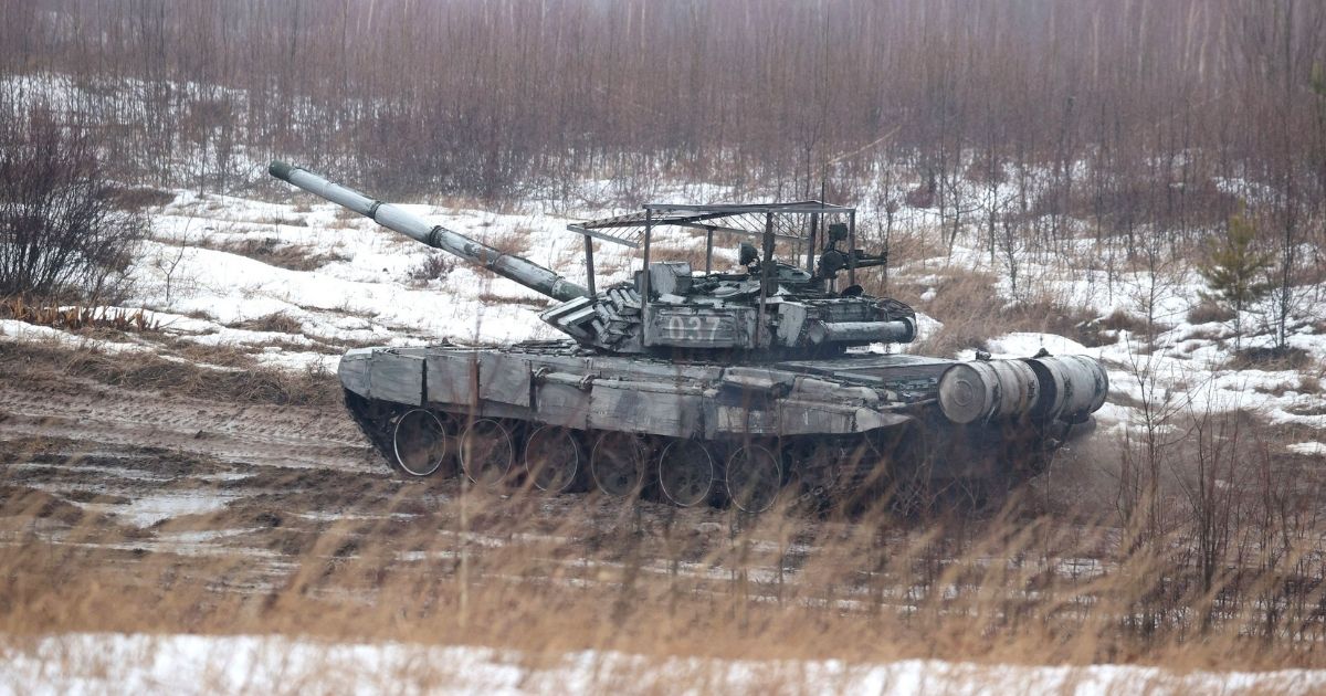 A tank moves in a field during joint exercises of the armed forces of Russia and Belarus near the town of Osipovichi, Belarus, outside Minsk, on Feb. 17.