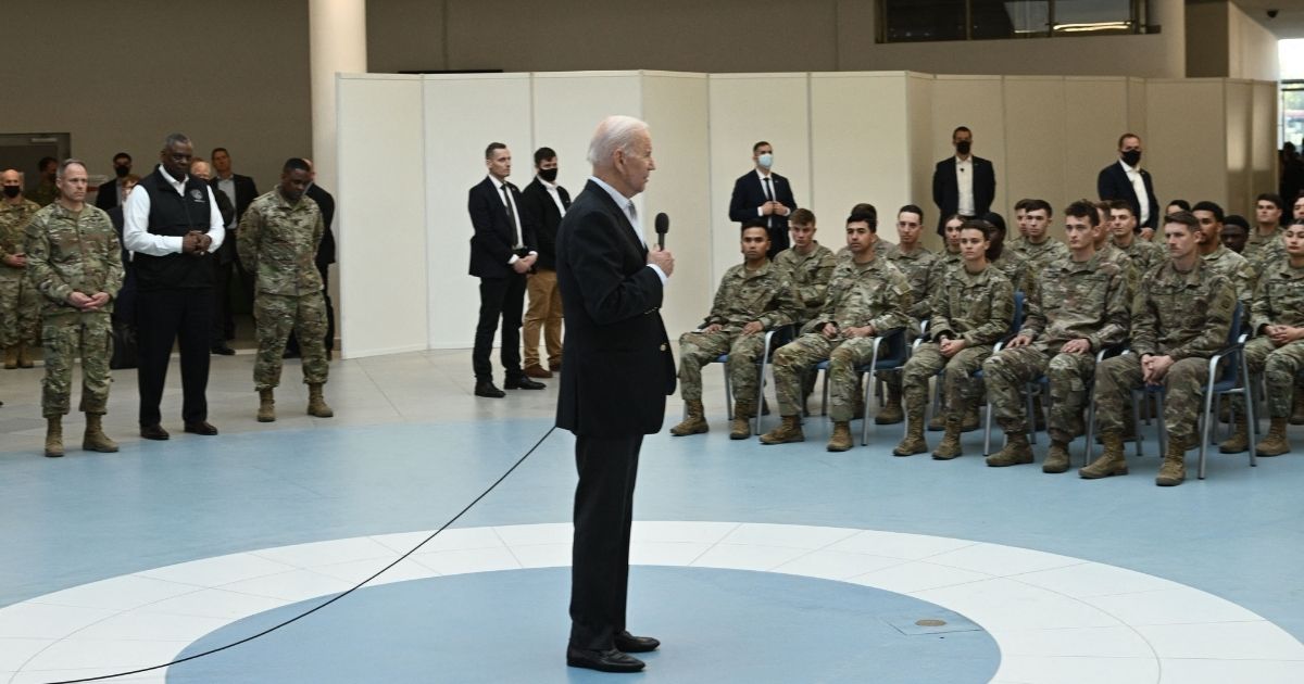 President Joe Biden talks to service members from the 82nd Airborne Division during his visit to Poland Friday.