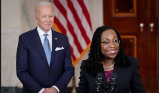 President Joe Biden, left, is congratulating himself for naming Ketanji Brown Jackson as the first black woman to be nominated to the US Supreme Court, but troubling details have surfaced regarding Jackson's past judicial opinions and rulings.