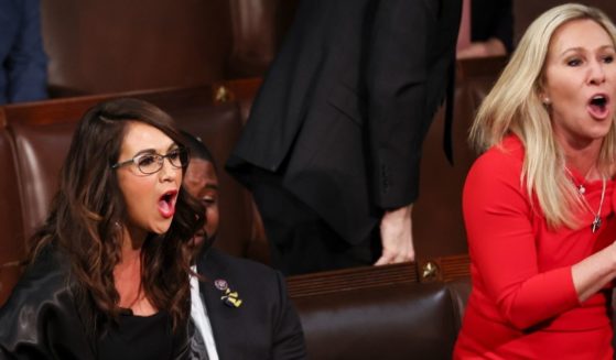 Republican Reps. Lauren Boebert of Colorado and Marjorie Taylor Greene of Georgia chant "Build the wall" after President Joe Biden mentioned the need to secure the border during his State of the Union address at the Capitol in Washington on Tuesday.