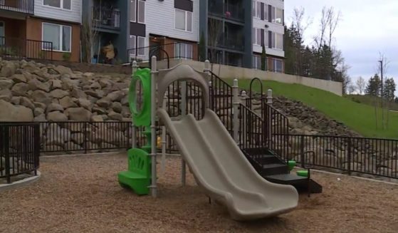 Neighbors sprang into action when they saw the man leading the boy away from the playground and into his apartment.