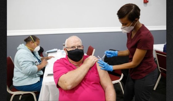 A resident of Tampa, Florida, receives a COVID vaccine in this file photo from February 2021. The FDA has approved another booster for the elderly and those with compromised immunity.