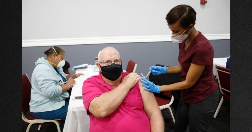 A resident of Tampa, Florida, receives a COVID vaccine in this file photo from February 2021. The FDA has approved another booster for the elderly and those with compromised immunity.