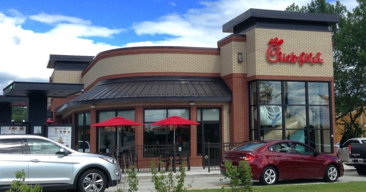 A long line of cars wraps around the drive thru of a Chick-fil-A in Wallingford, Connecticut.