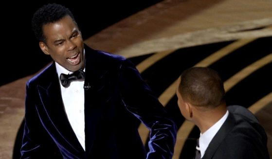 Chris Rock reacts after Will Smith walked onstage and slapped him during the 94th Annual Academy Awards at the Dolby Theatre in Hollywood, California, on Sunday.