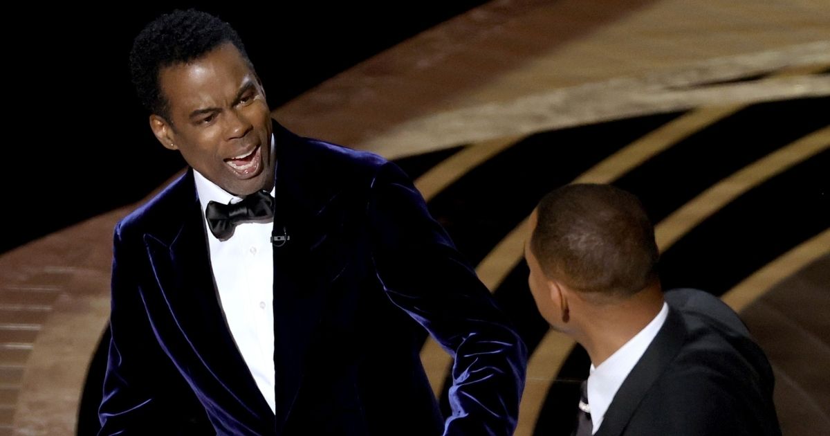 Chris Rock reacts after Will Smith walked onstage and slapped him during the 94th Annual Academy Awards at the Dolby Theatre in Hollywood, California, on Sunday.