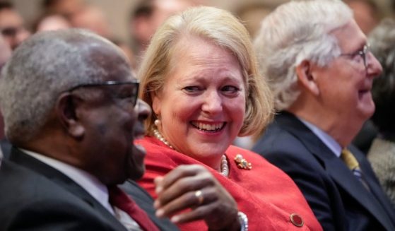 Supreme Court Justice Clarence Thomas sits with his wife Virginia Thomas at The Heritage Foundation on Oct. 21, 2021, in Washington, D.C.